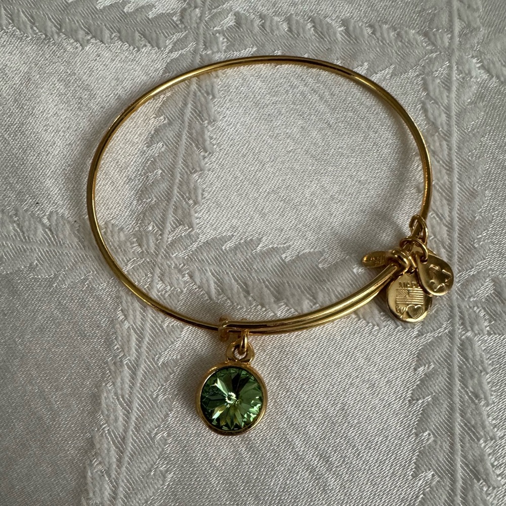 Alex and Ani Bangle with Green Crystal Charm.